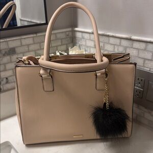 Elegant Cream Handbag with Black Charm